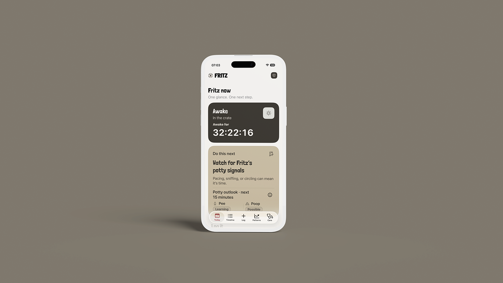 A single white clay iPhone showing the current Fritz Today screen on a warm stone background